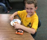 Boy eating applesauce