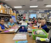 Altoona 1st Day 1st Grade Smiles at their Desks